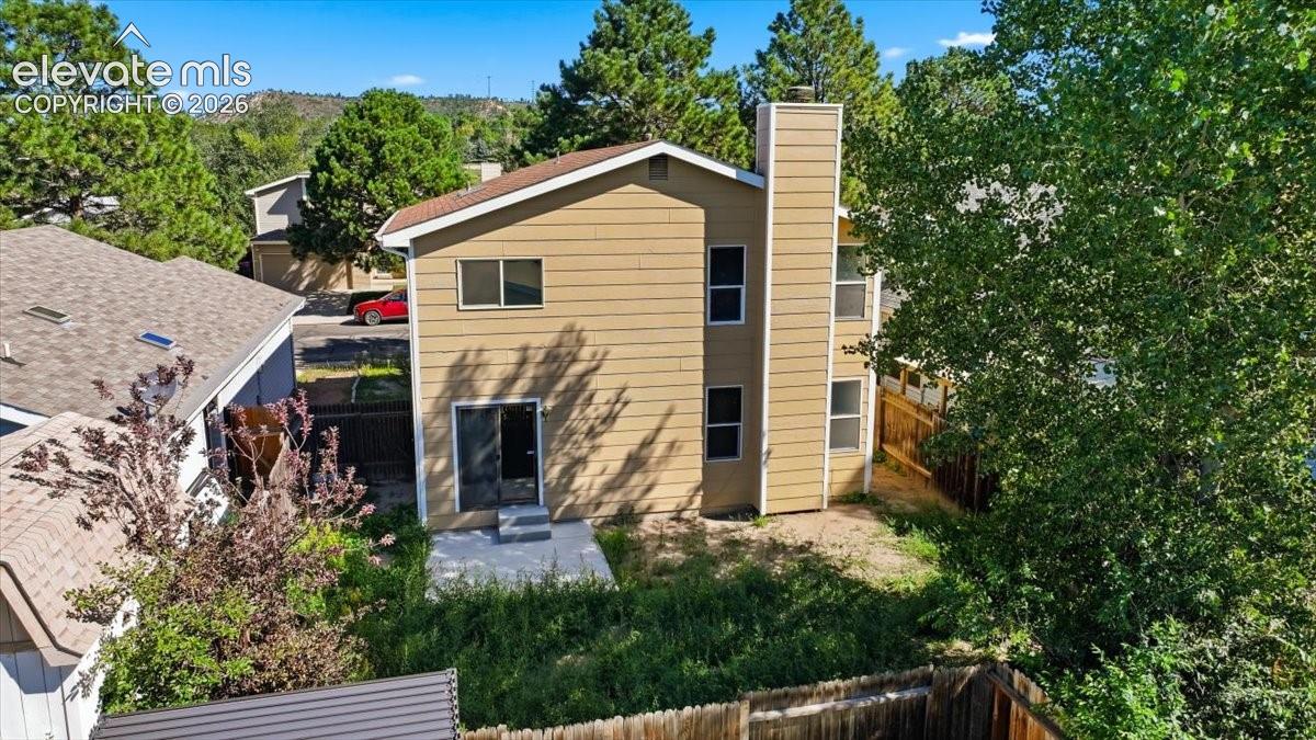 Aerial rear exterior view with a mountain backdrop at , Colorado Springs, CO.
