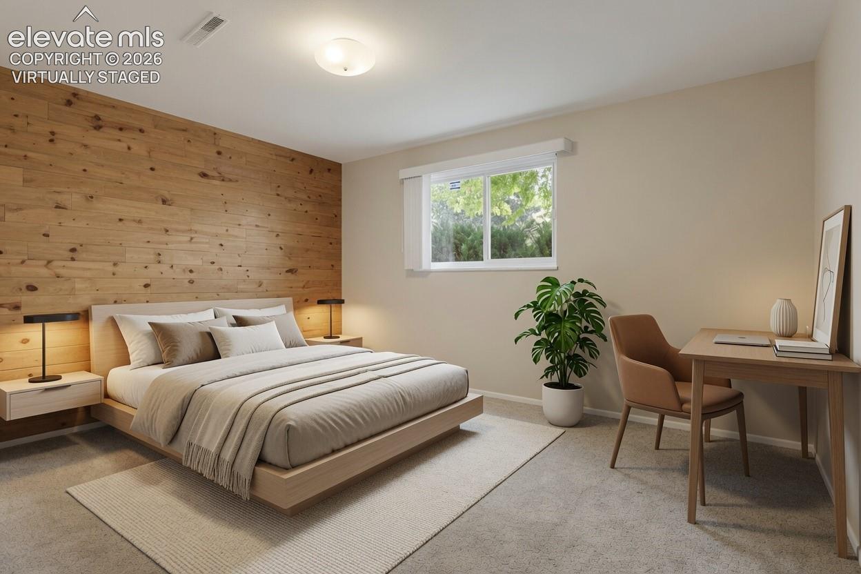 Virtually Staged Bedroom Serene primary bedroom showcasing a wood-accent accent wall with integrated bedside lighting, neutral upholstered bed frame, and soft area rug anchoring the space