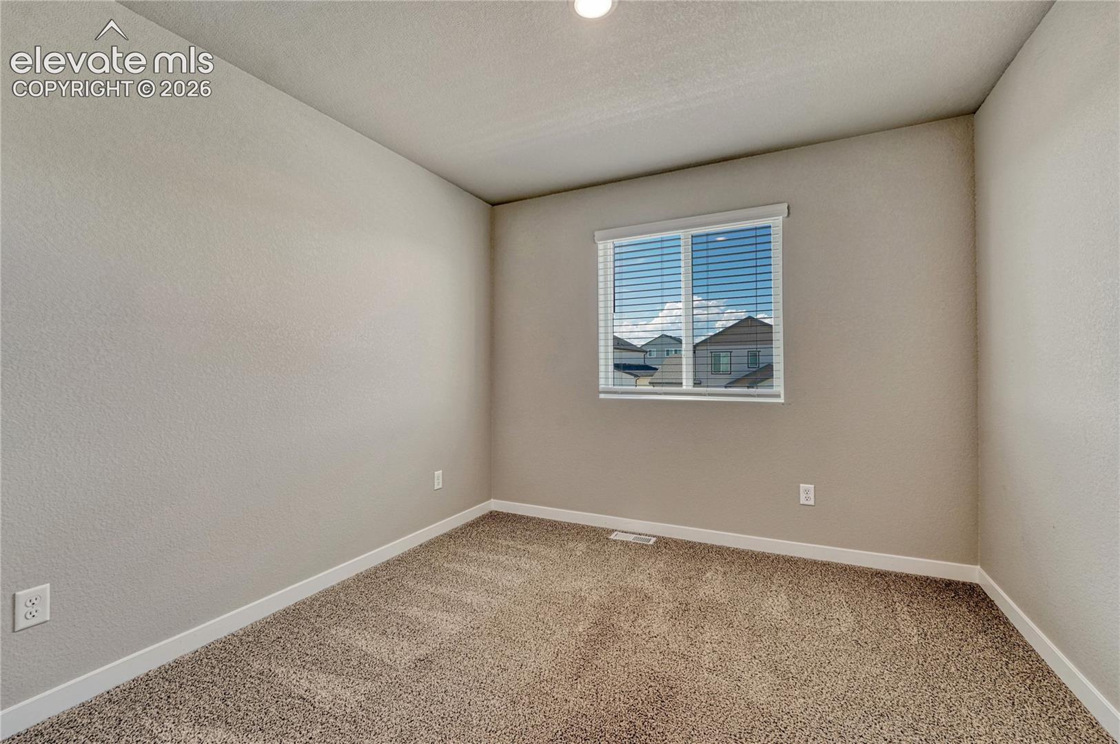 First of three additional bedrooms. 