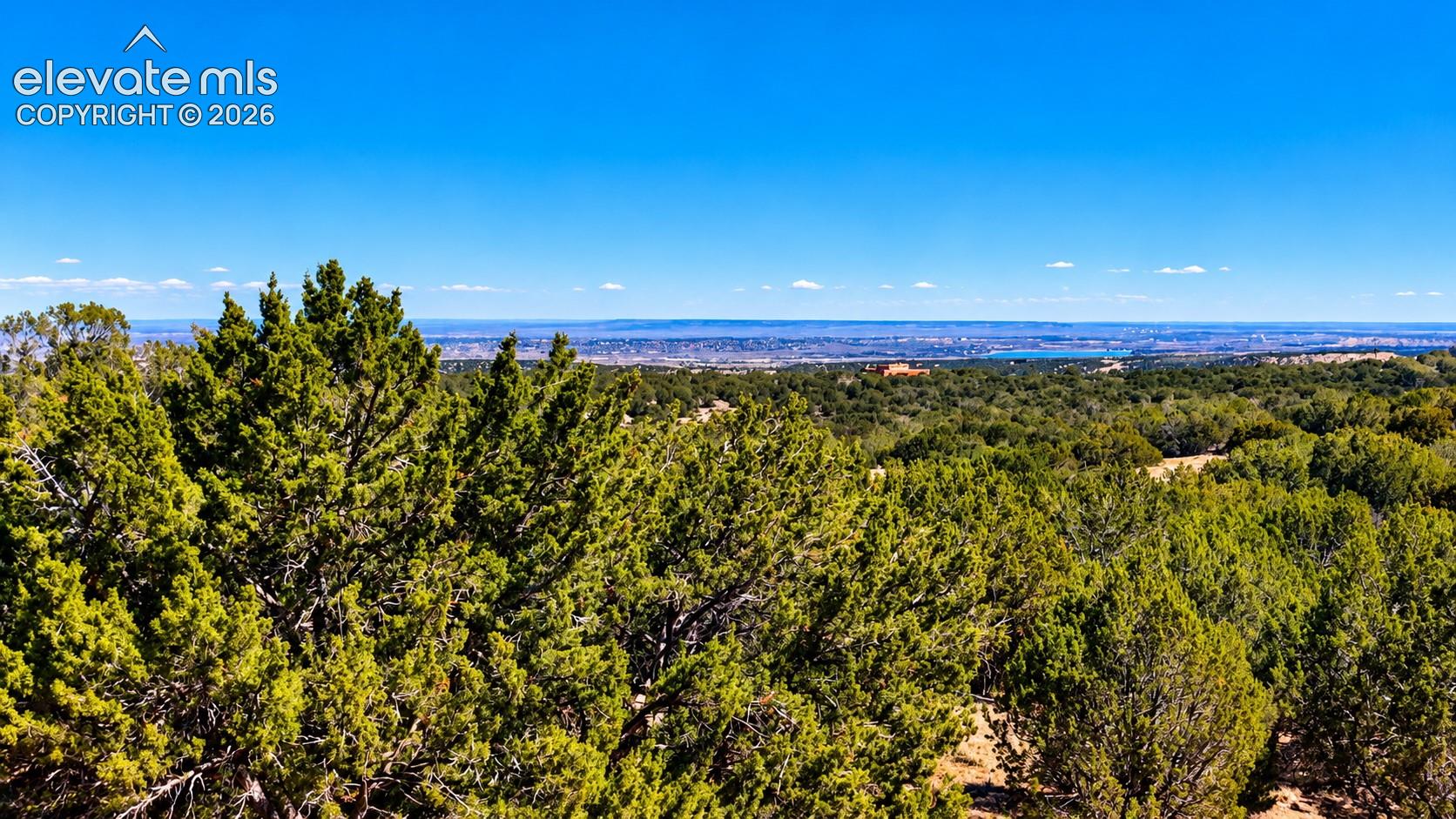 Beautiful elevated views overlooking the juniper-covered countryside, with glimpses of Pueblo Reservoir in the distance. Enjoy expansive scenery and wide-open Colorado skies.

