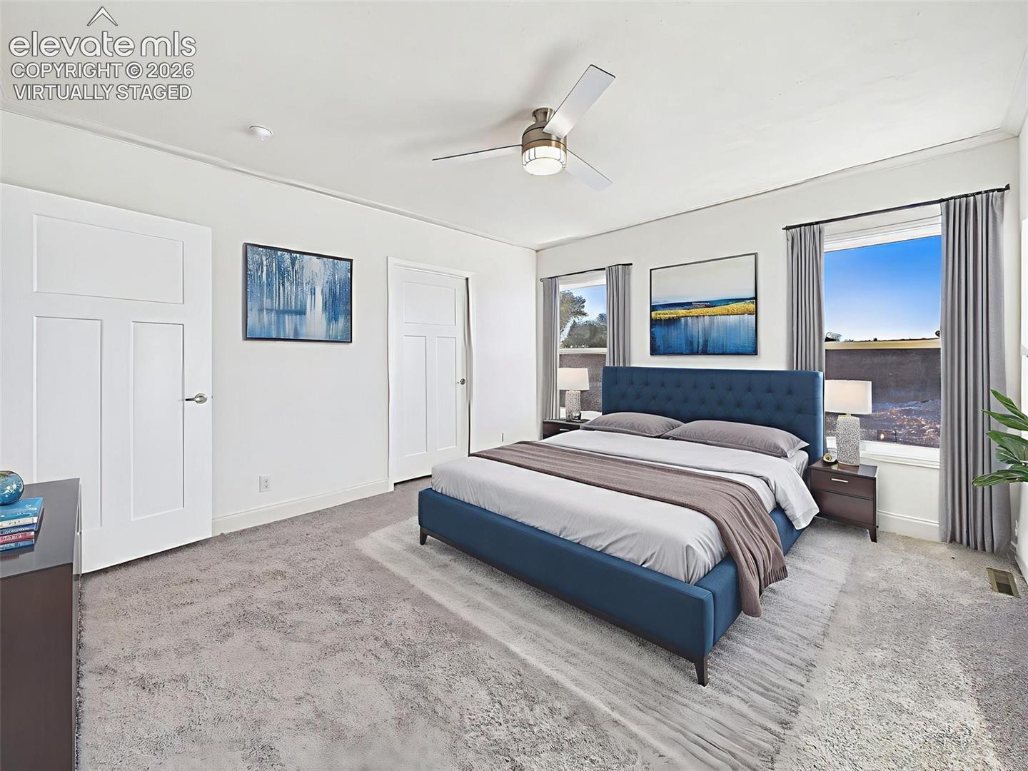 Virtually Staged Alternate view of the primary suite showing ensuite entry and spacious layout.