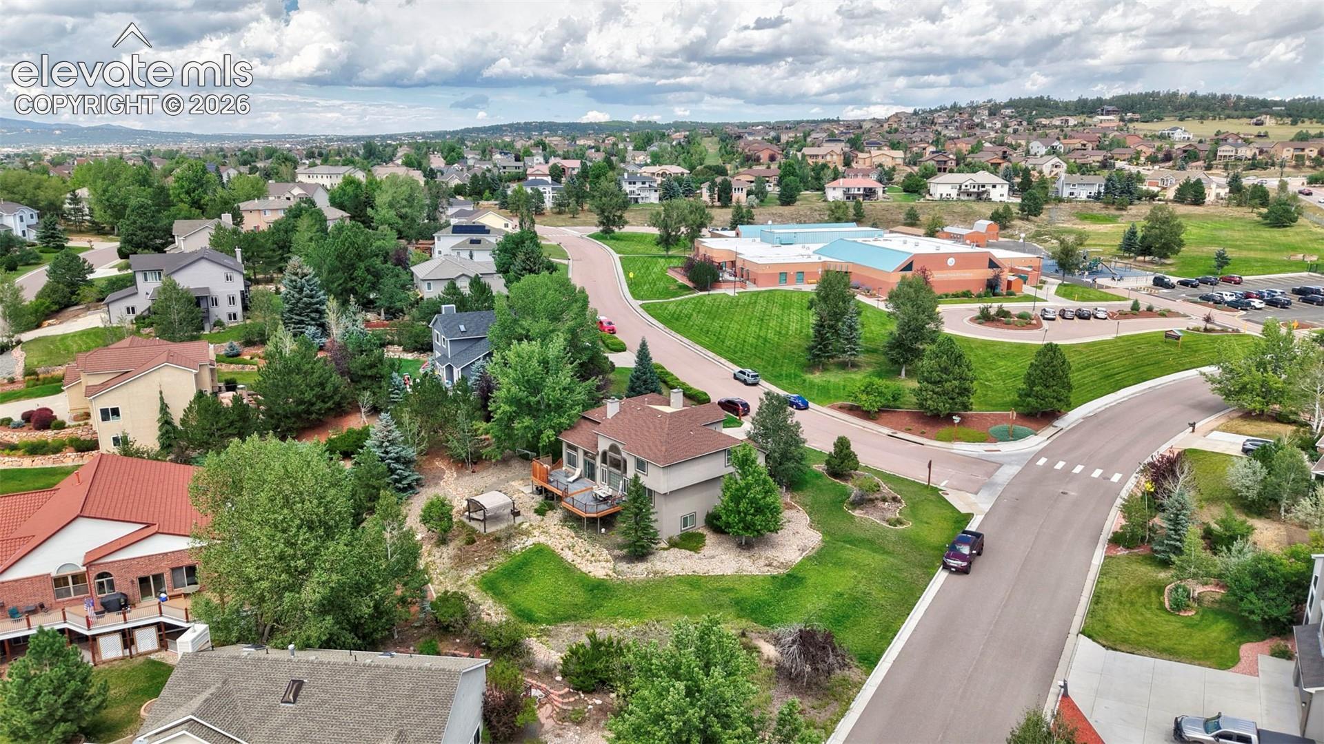 Expansive residential neighborhood with mature trees and varied architectural styles