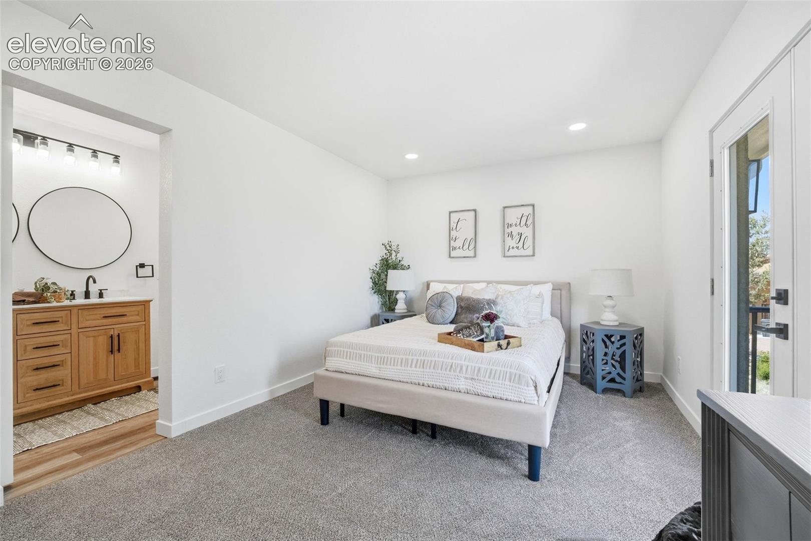 Bedroom featuring light gray carpeting, recessed lighting, and white walls