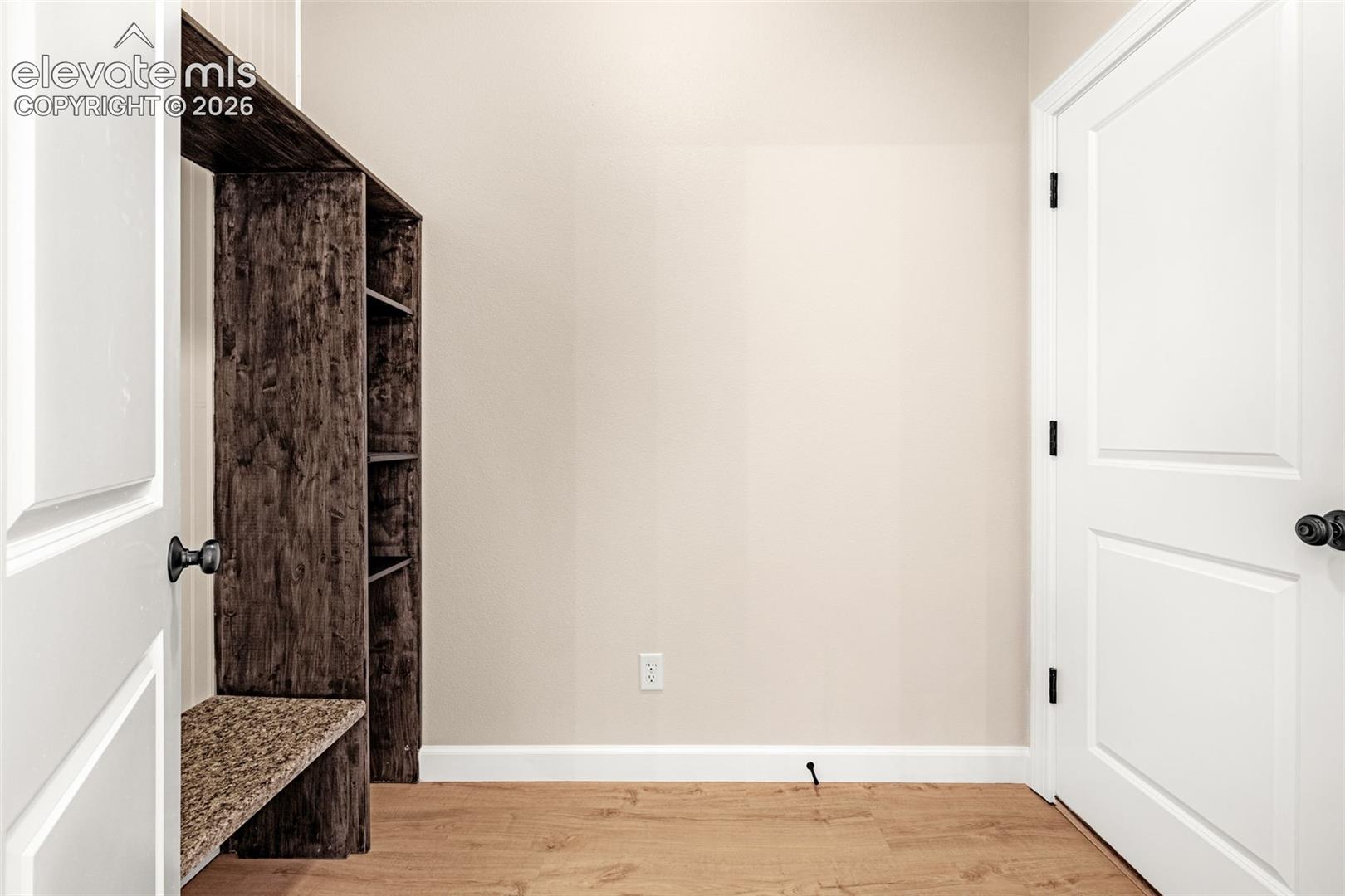 Owner's entrance has a mud room with built in shelving and bench to keep organized.  