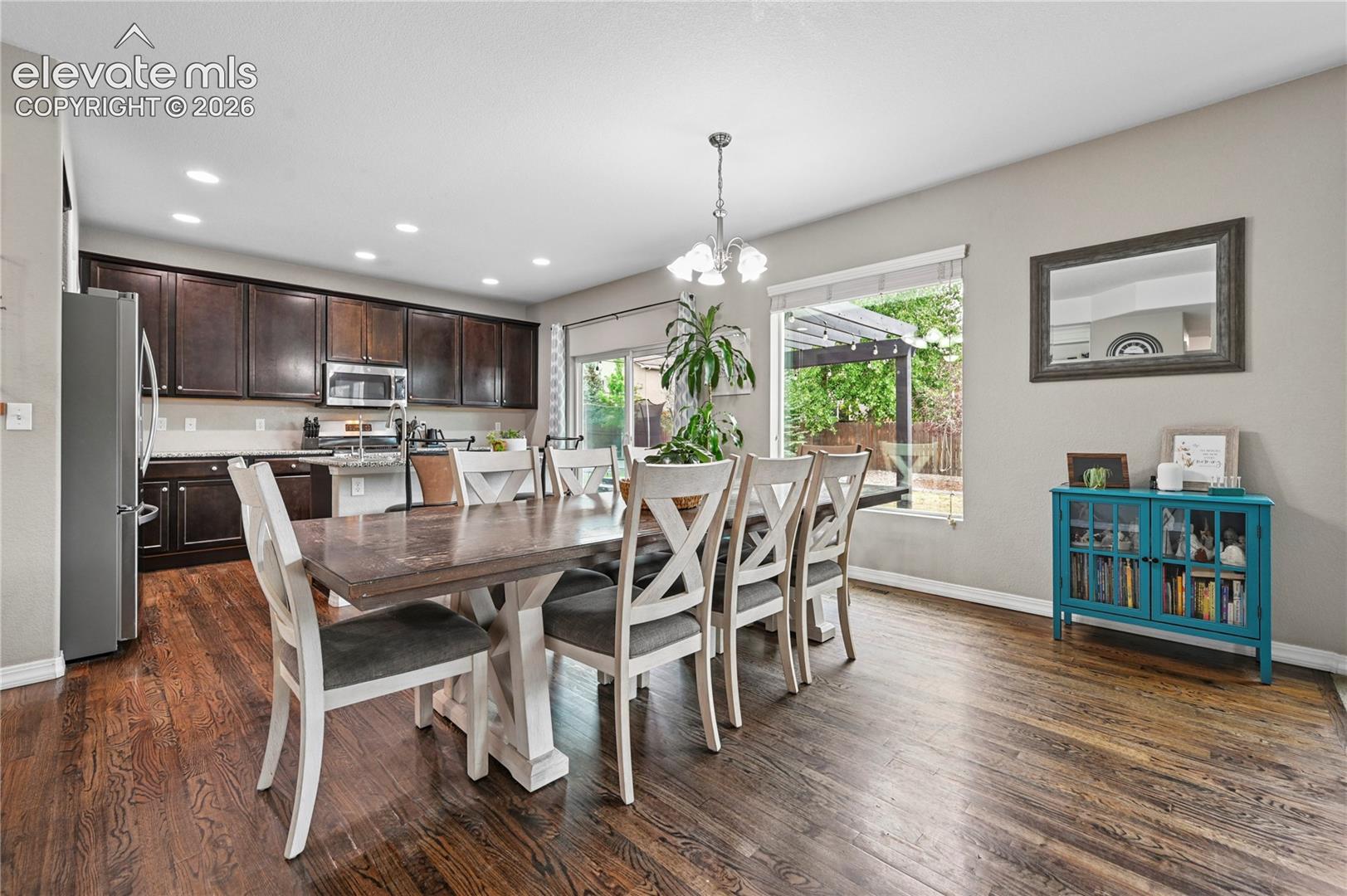 You'll enjoy the broad, open dining and kitchen areas that are filled with daylight and warmed by rich natural wood upgrades.  There's room for loved ones around your table.
