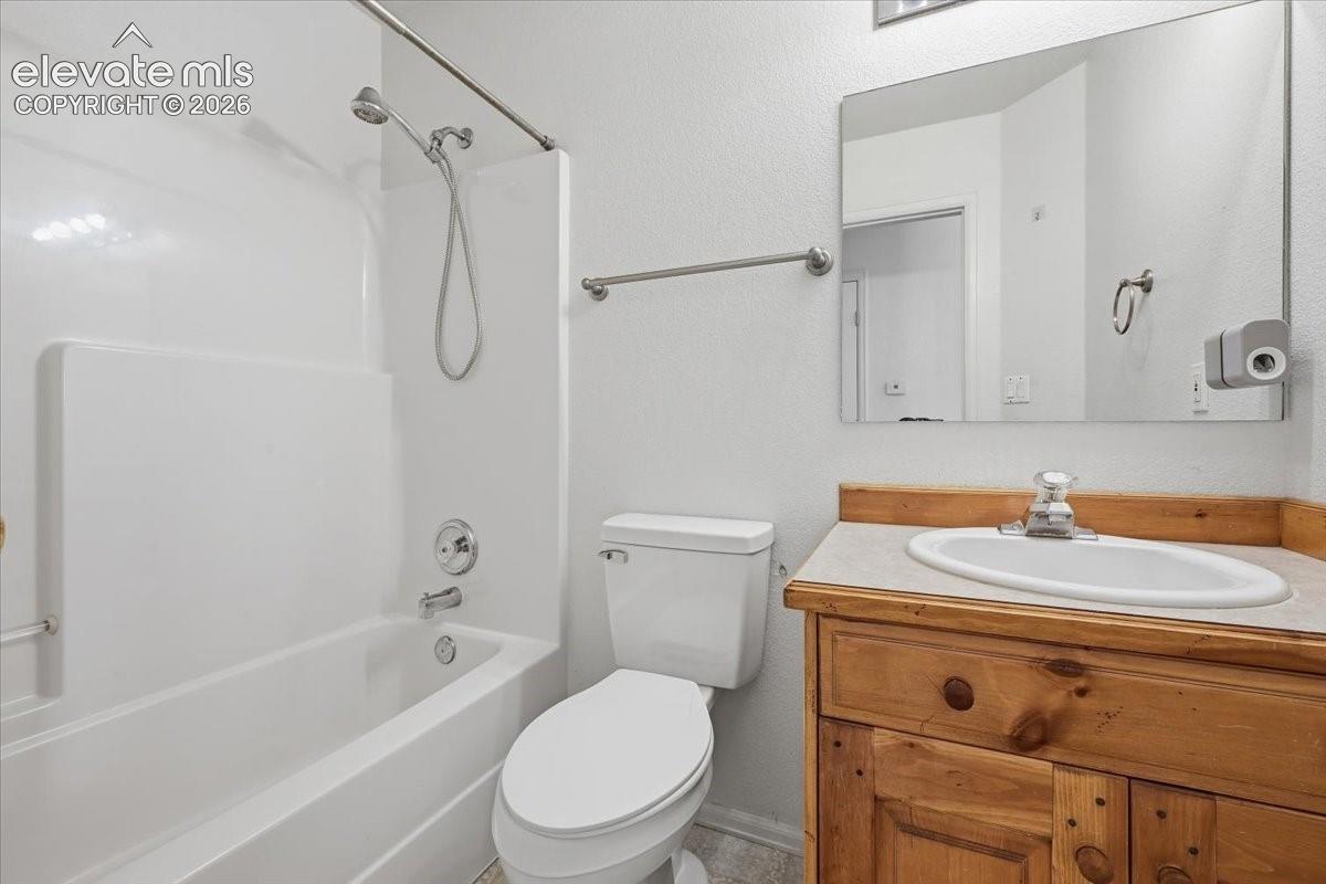 White tub/shower combination with chrome fixtures