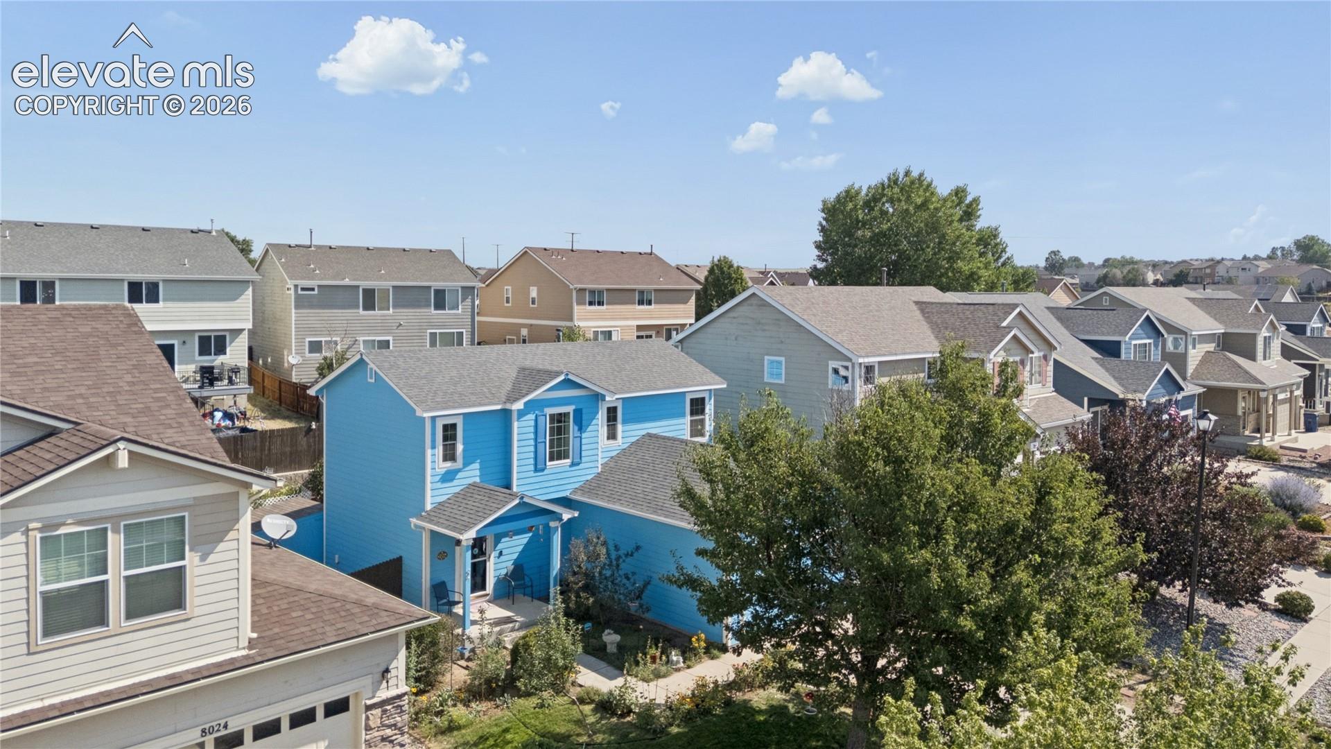 Blue exterior siding with white trim and shutters