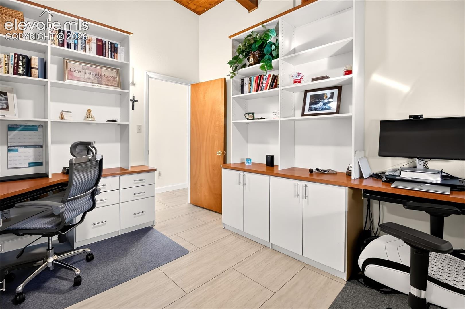 A secondary bedroom currently used as an office