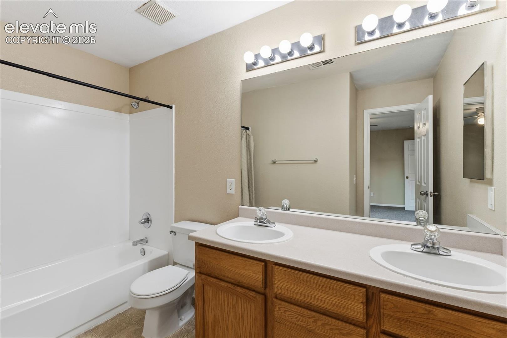 The full Primary Bathroom with its double vanity sink!