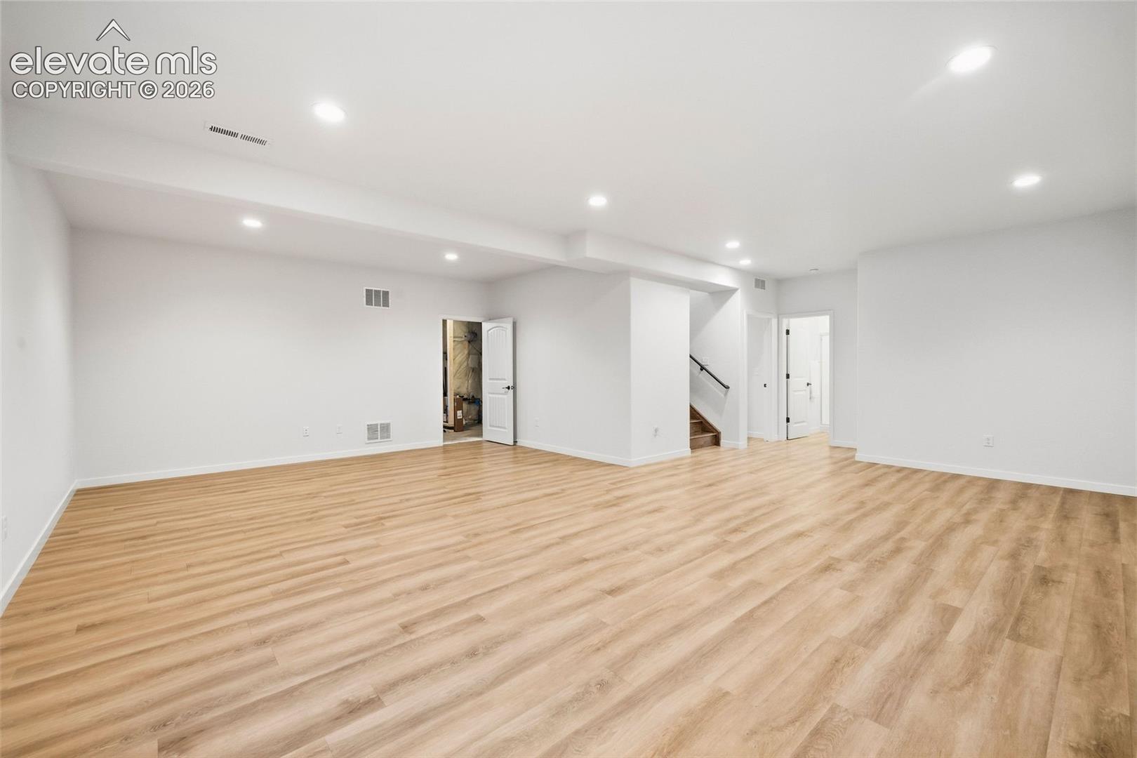Many basement family rooms are dark and choppy and you can't imagine how you'll actually use the space. This family room is open, bright and square to make it easy for you to place furnishings and set up zones for how you wish to use all the square footage.