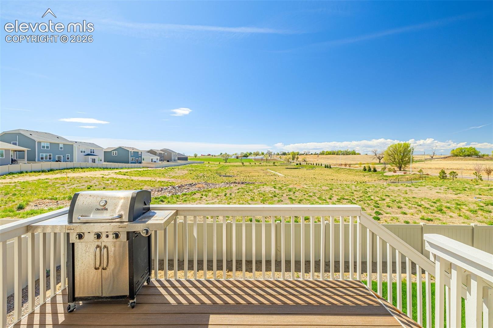 Expansive outdoor deck with composite decking and white railings