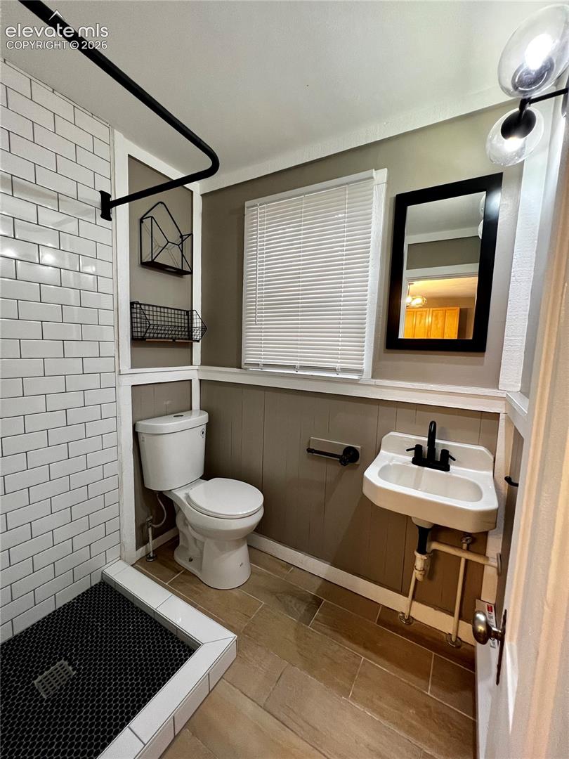  Upper Apt: View of the Renovated 3/4 bathroom. Wall items above toilet are  included.