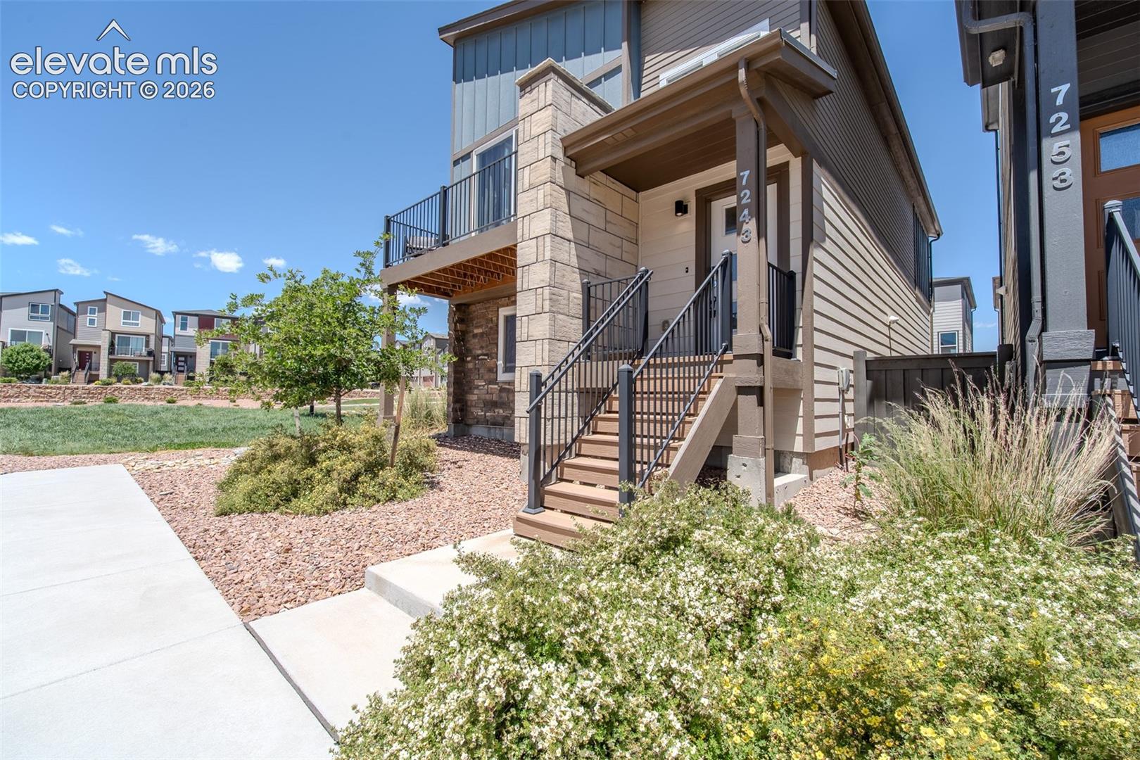 Stairs to the covered front porch.