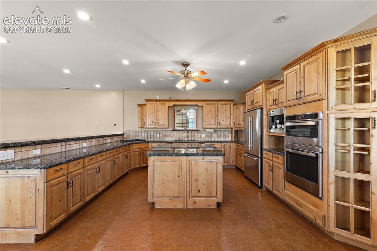 Granite countertops surfaces on cabinets and Island, stovetop, microwave and oven are all new in 2026. Refrigerator and dishwasher are also included but age is unknown. lots of storage cabinets and breakfast bar area.
