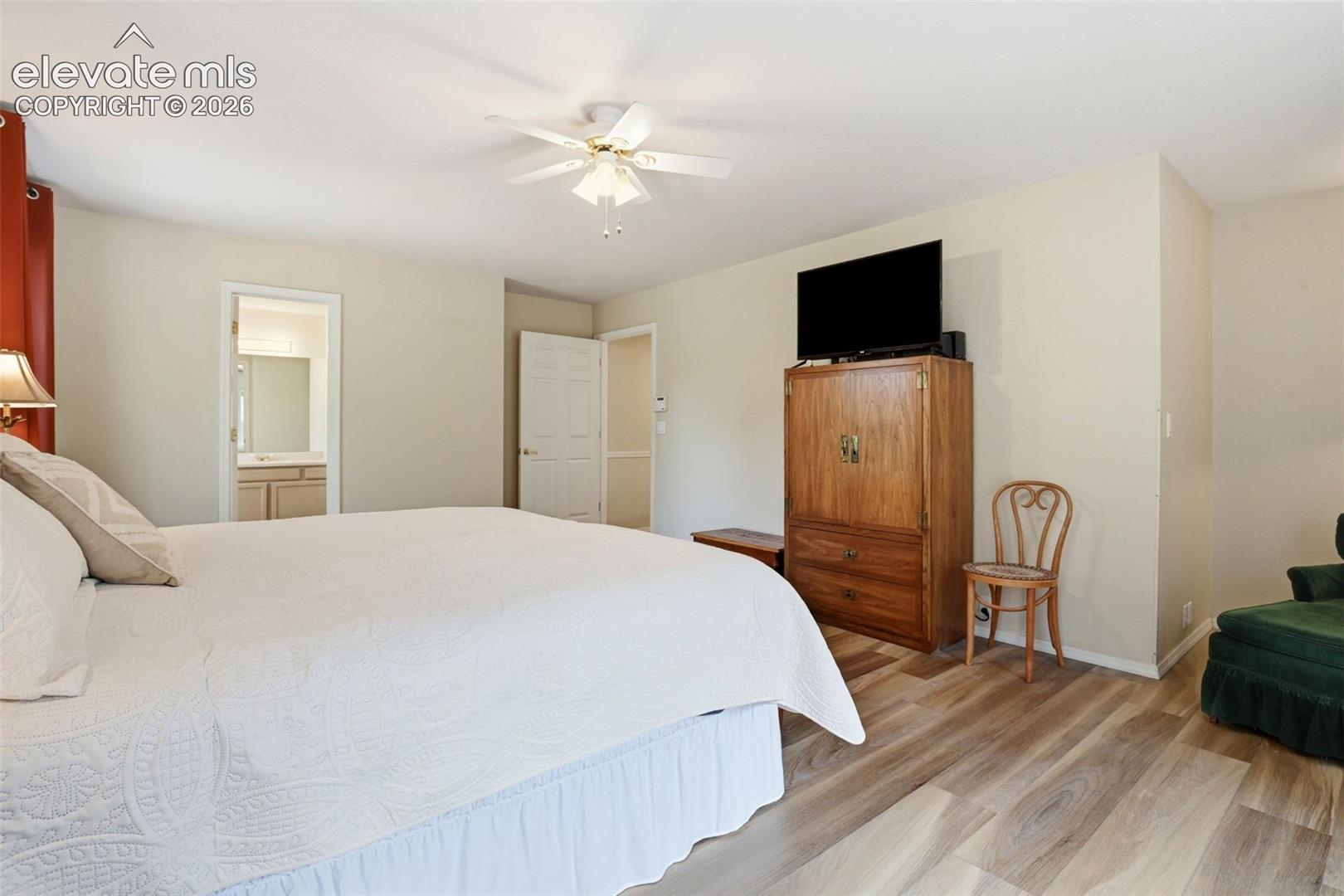 Primary bedroom adjoins the primary bath and walk-in closet