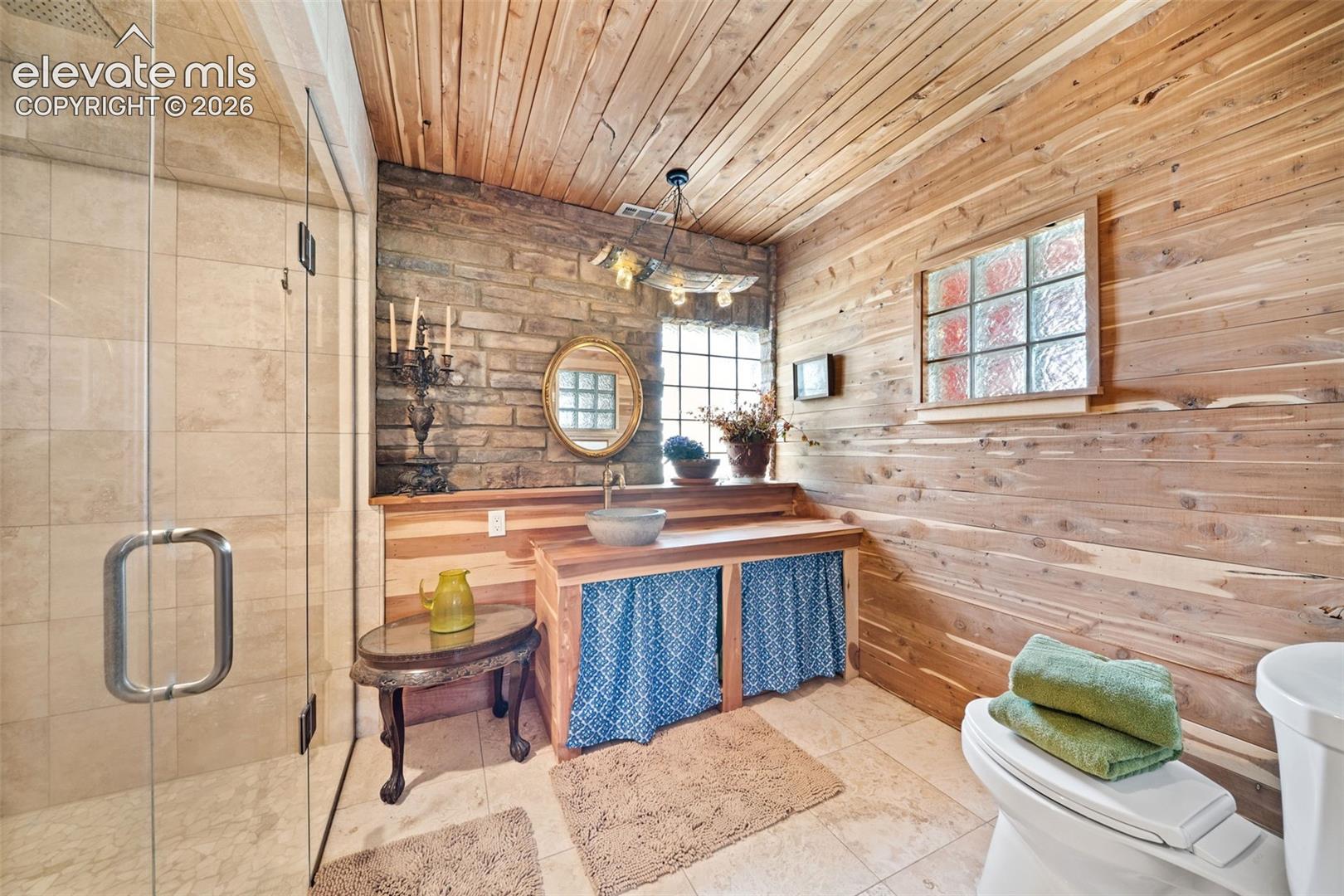 Beautiful primary en-suite featuring a walk-in tile shower.