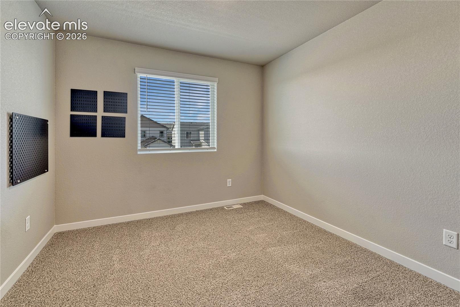 Third of three additional bedrooms. 
