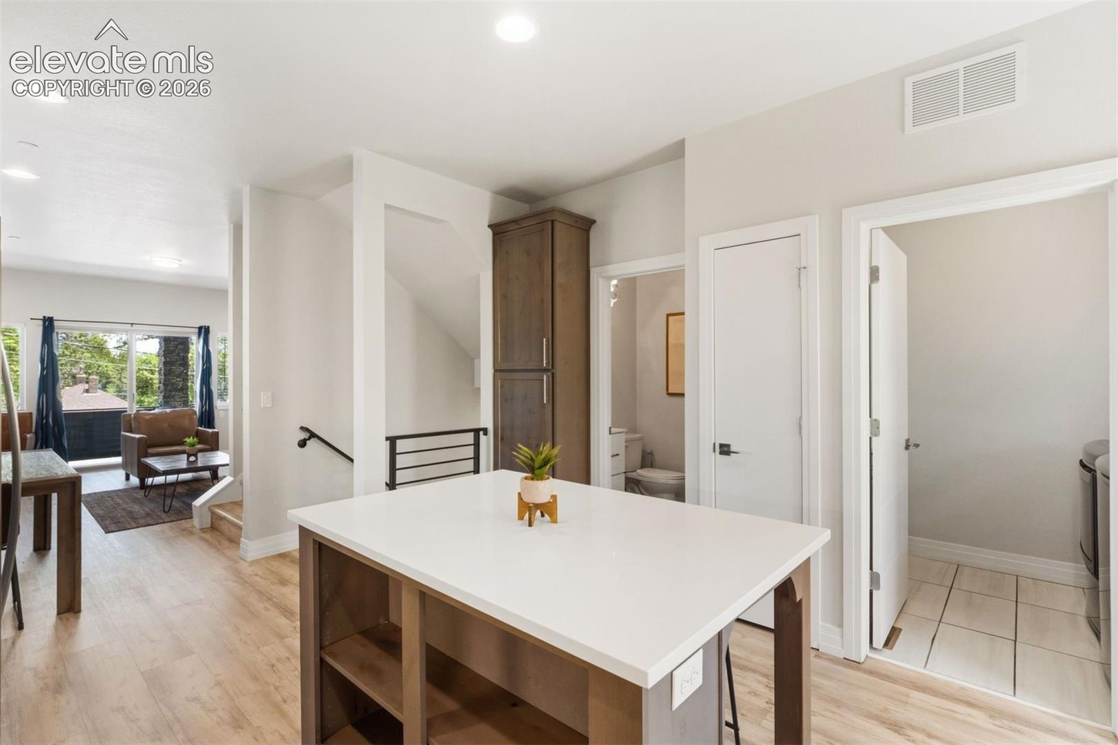 Kitchen with center island and walkout access to back yard