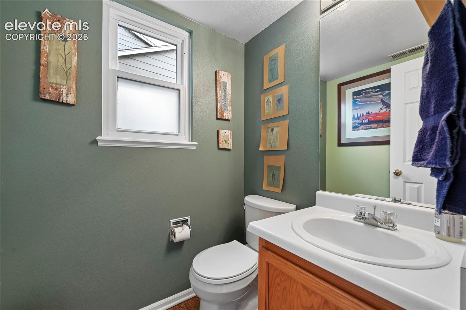 Main level powder room in the back hallway