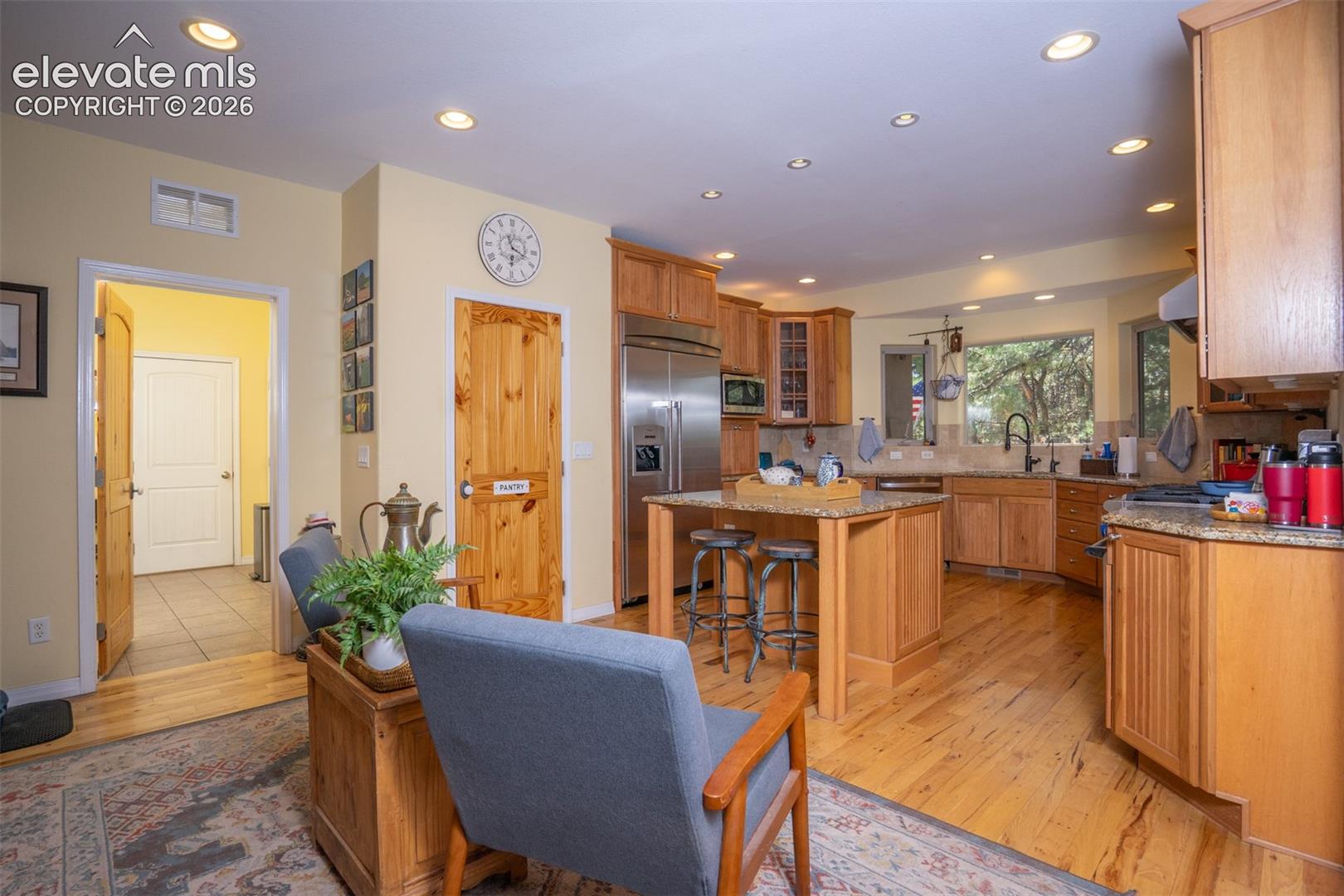 The kitchen area offers bar seating and room for extra chairs and/or a casual eating area