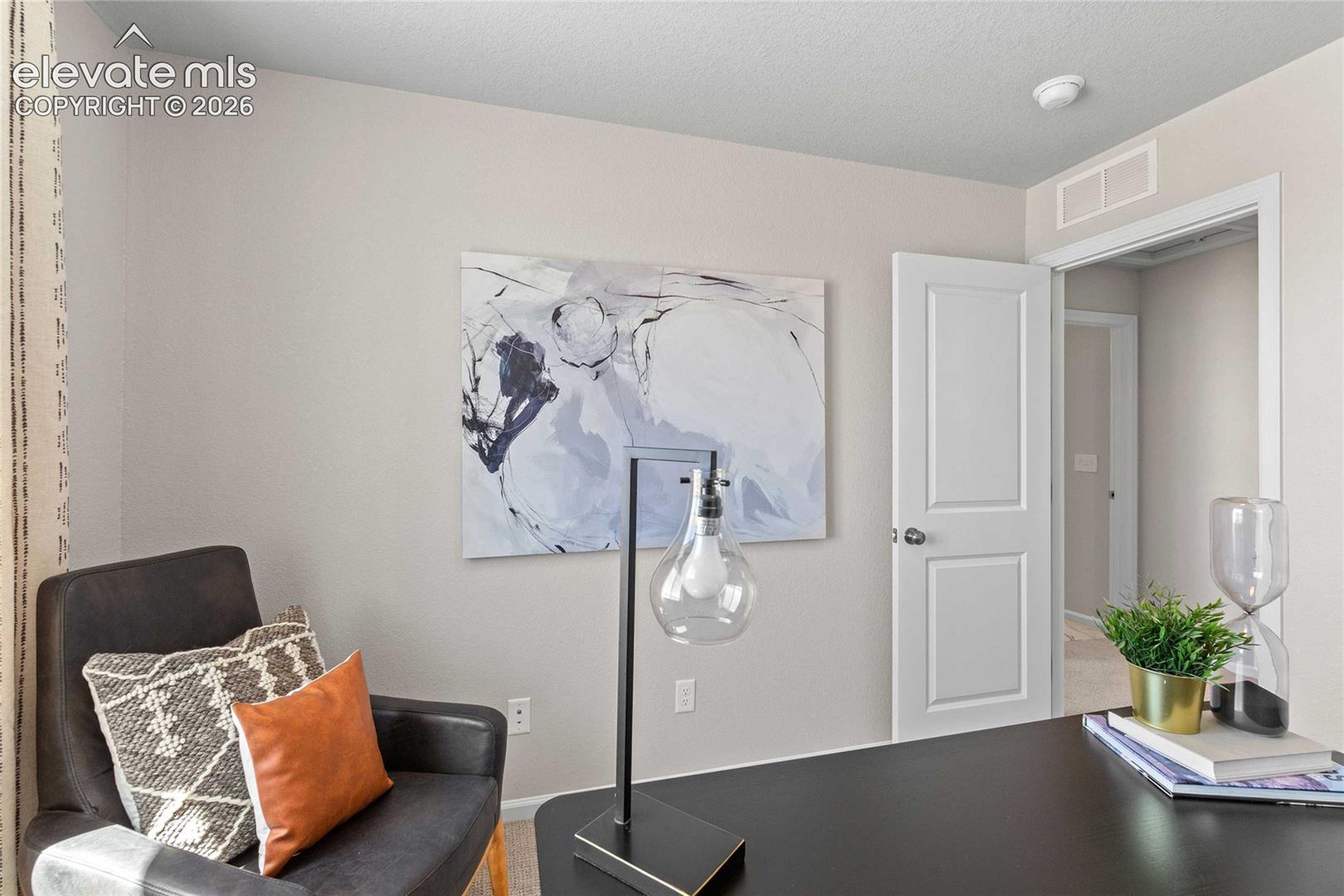 White paneled interior door, neutral wall tones, and recessed lighting
*photos of a model home*