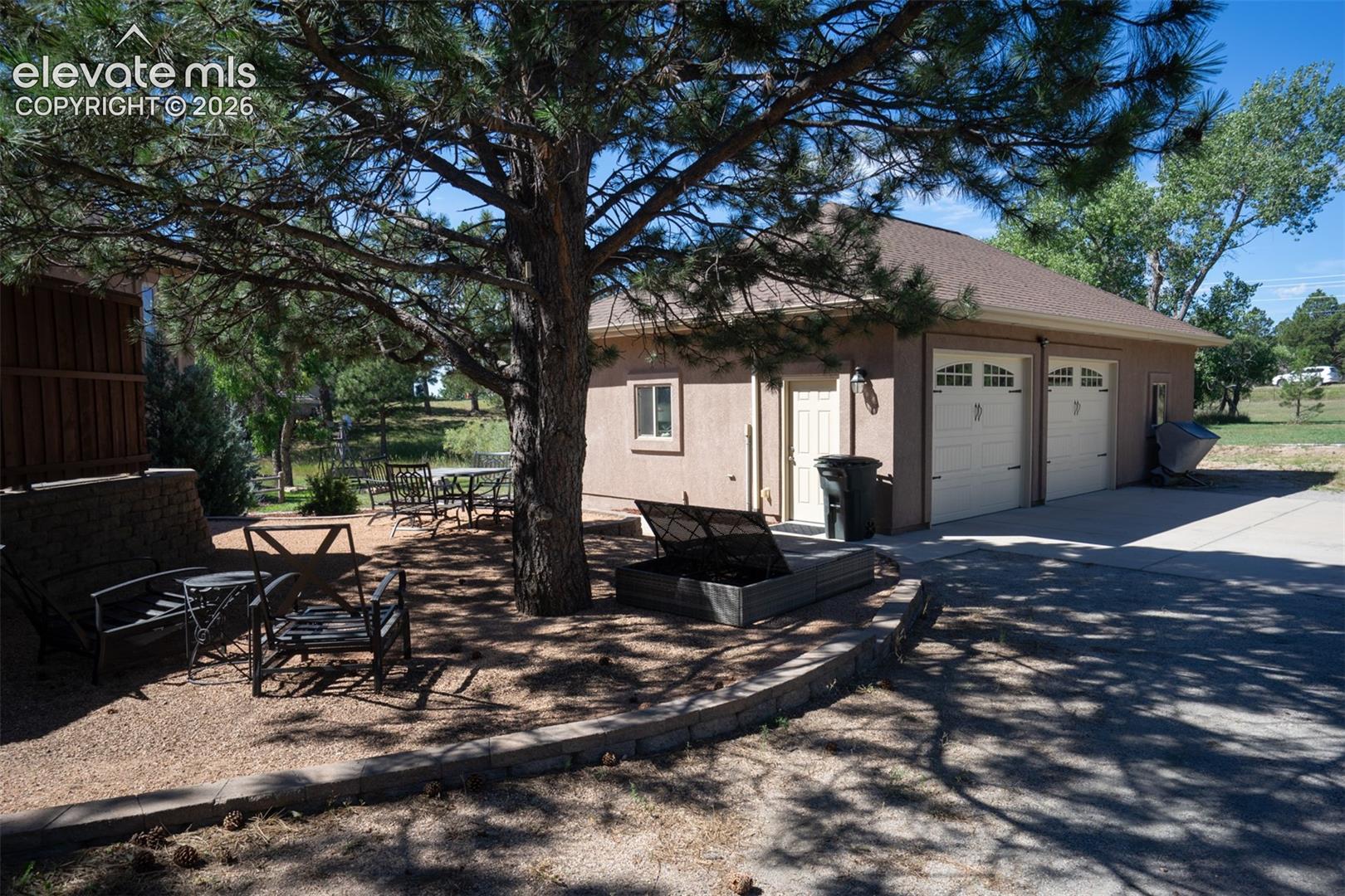 This second, detached 2-car garage has space for a workshop within the garage but there's a bonus room, too!