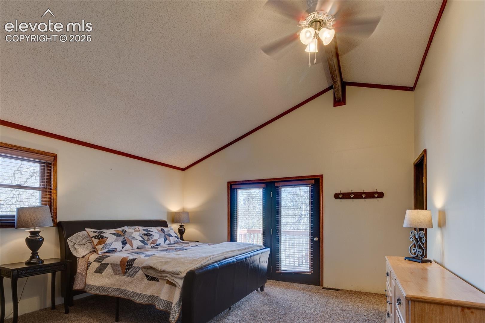 Primary bedroom with private deck + adjoining bath