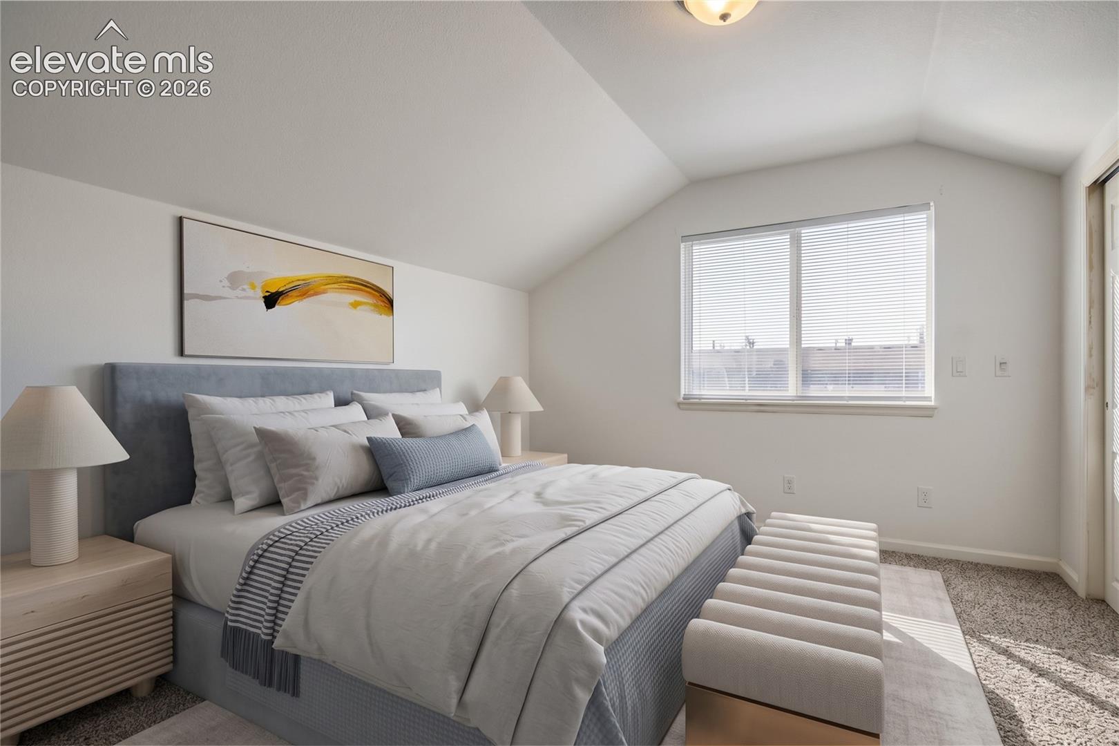 Vaulted ceiling with neutral wall tones, carpeted flooring, and a window with integrated blinds