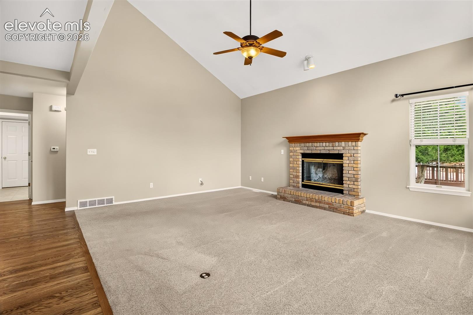 Hall on the left going toward the garage, front door, and main level bedroom/bath.