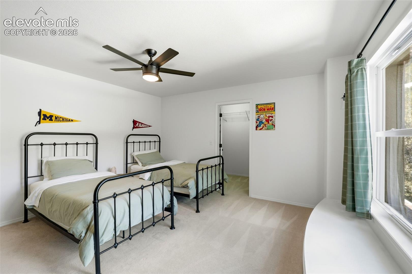 Secondary upstairs bedroom with adorable window seat