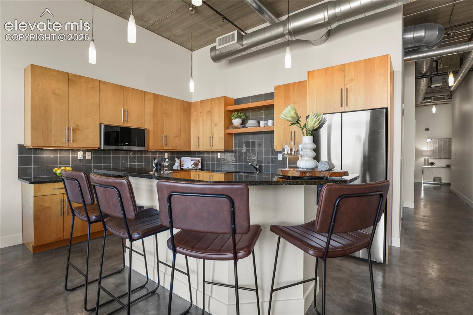 Beautiful yet functional kitchen with custom solid front maple cabinets