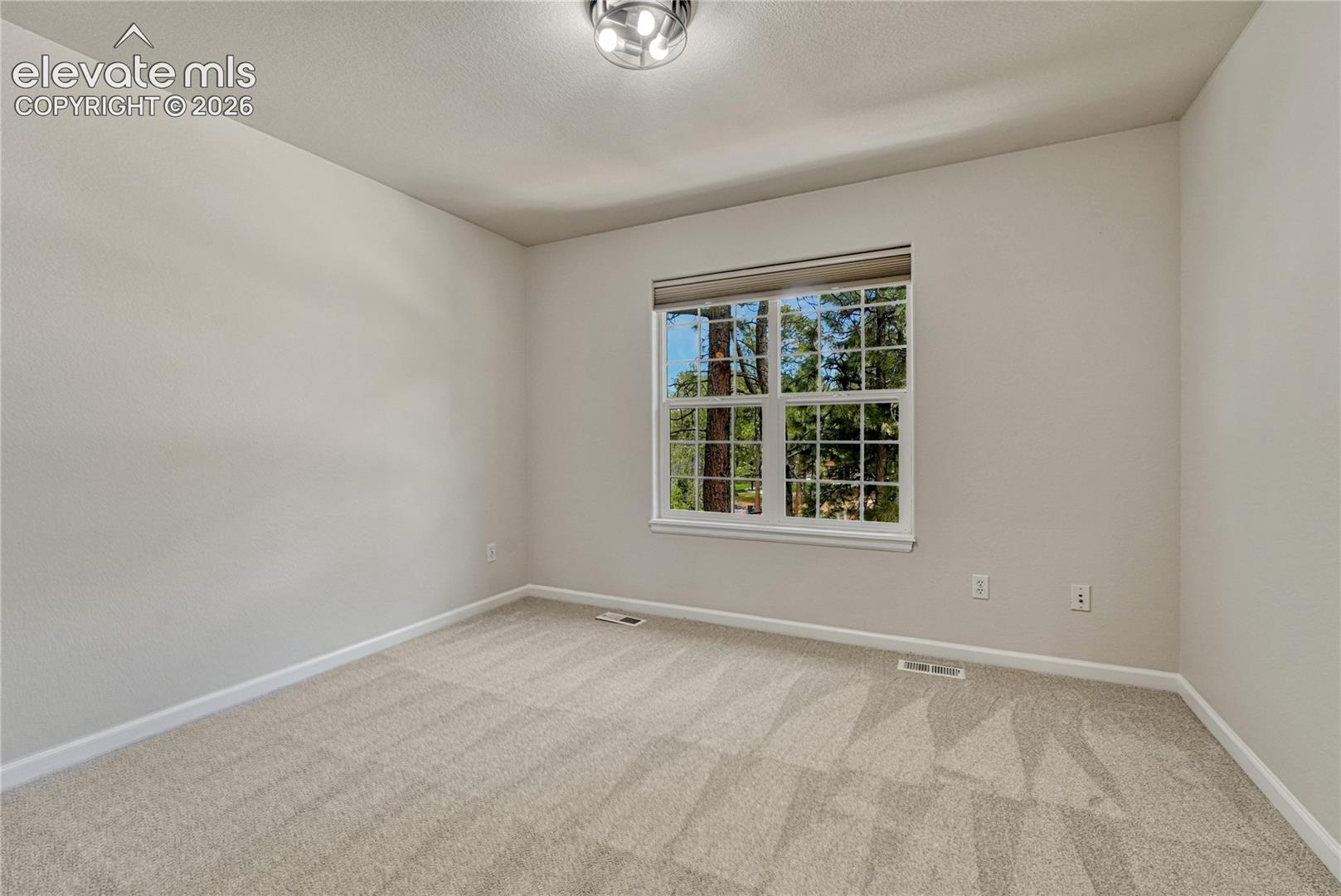First of two additional upstairs bedrooms. 
