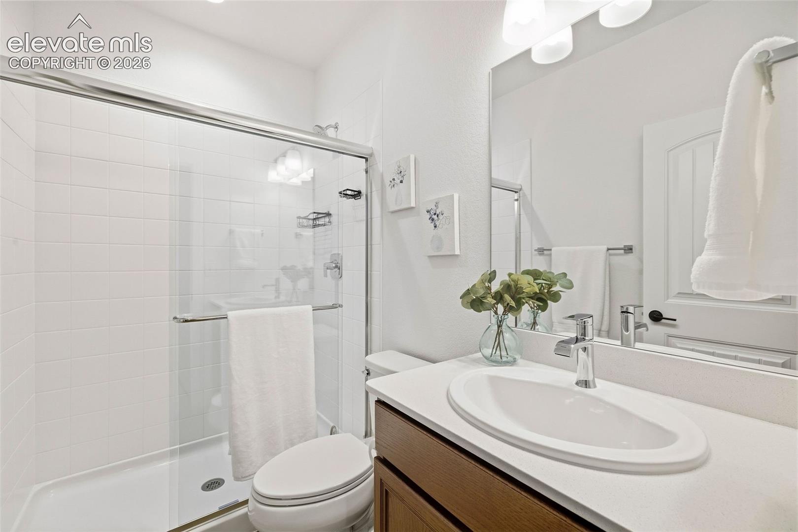 This 3/4 bath on the basement level serves both bedrooms and the family room. 