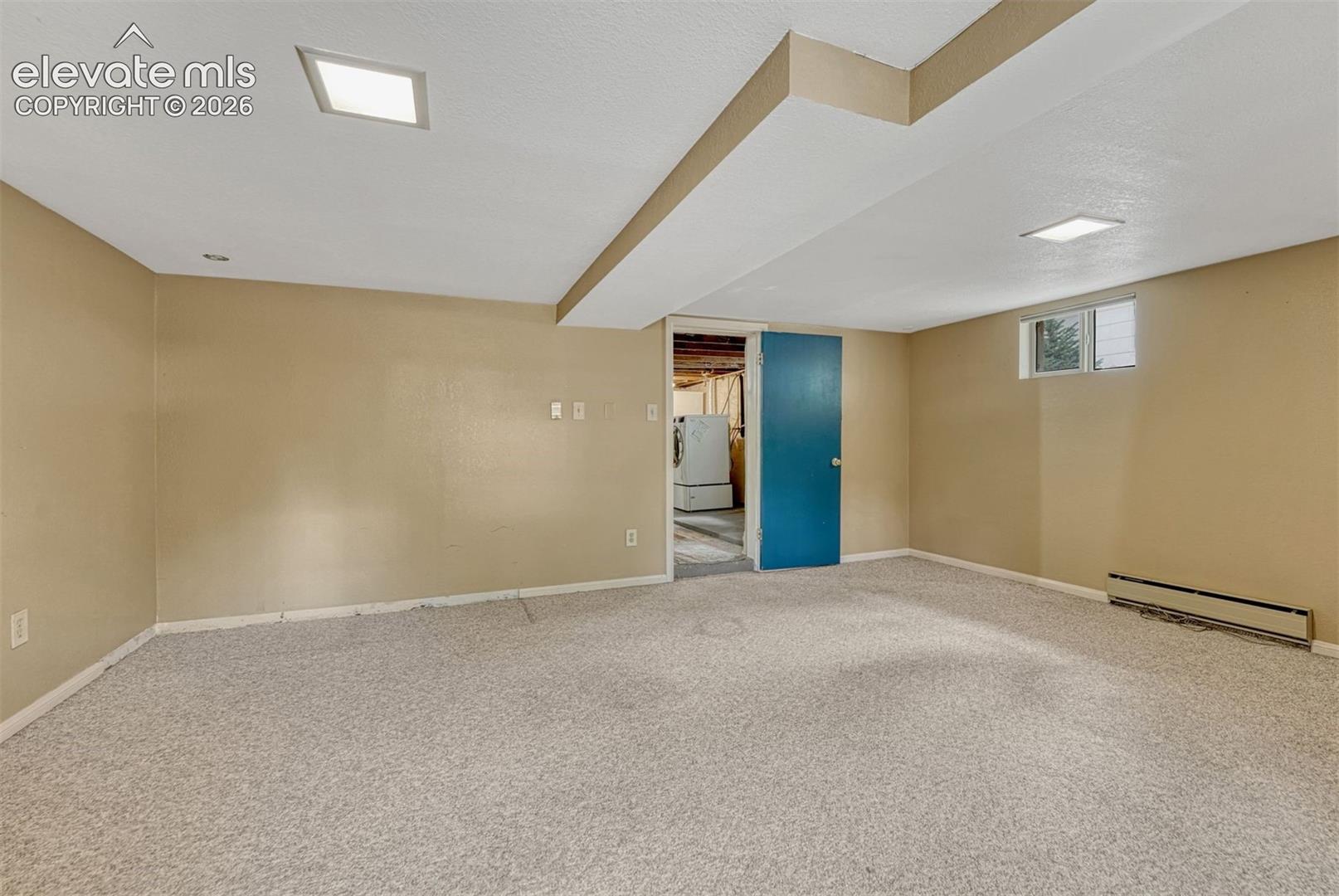 Just add a wardrobe to this very large basement bedroom