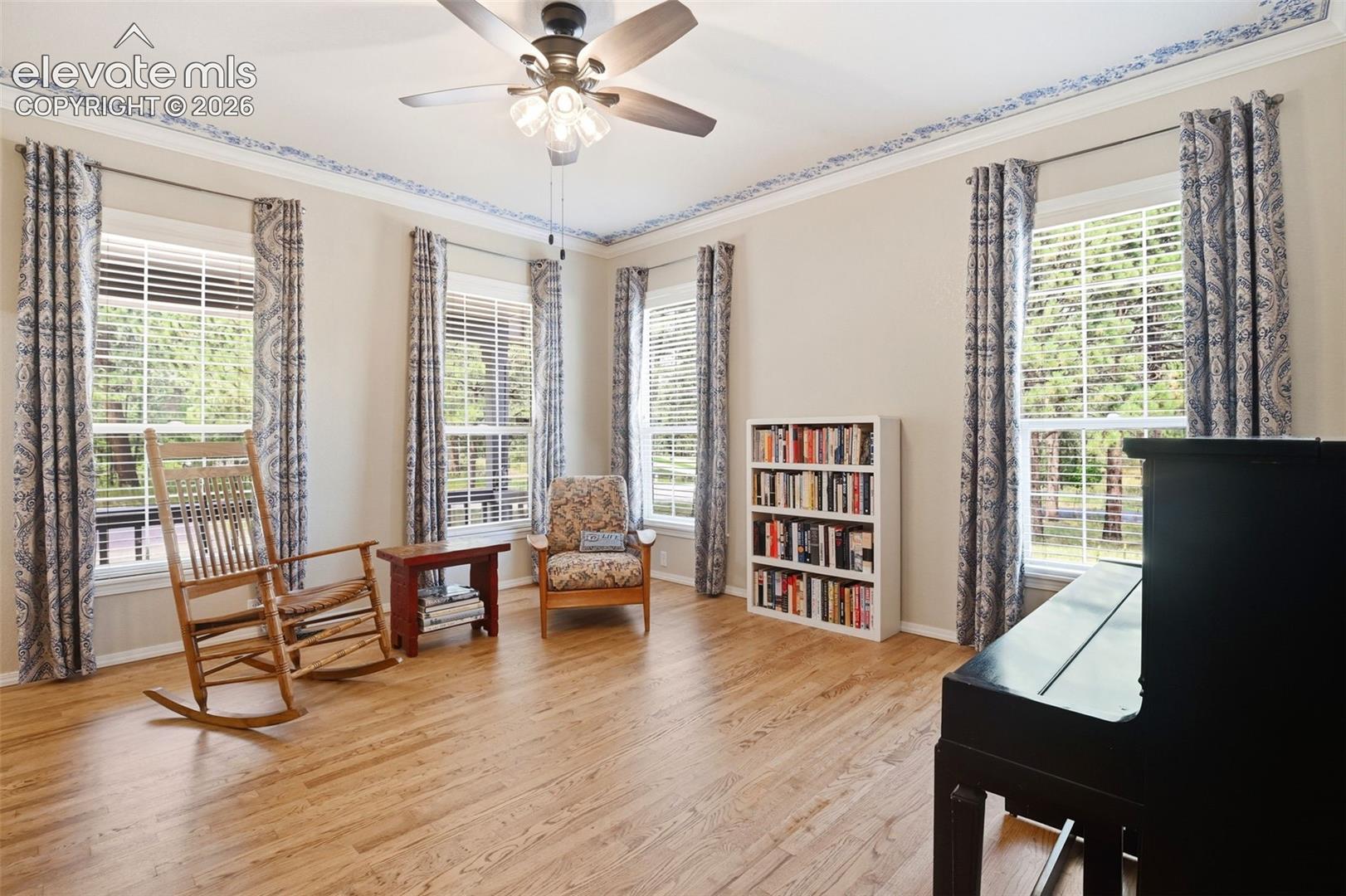 Crown molding, newer flooring and ceiling fan.