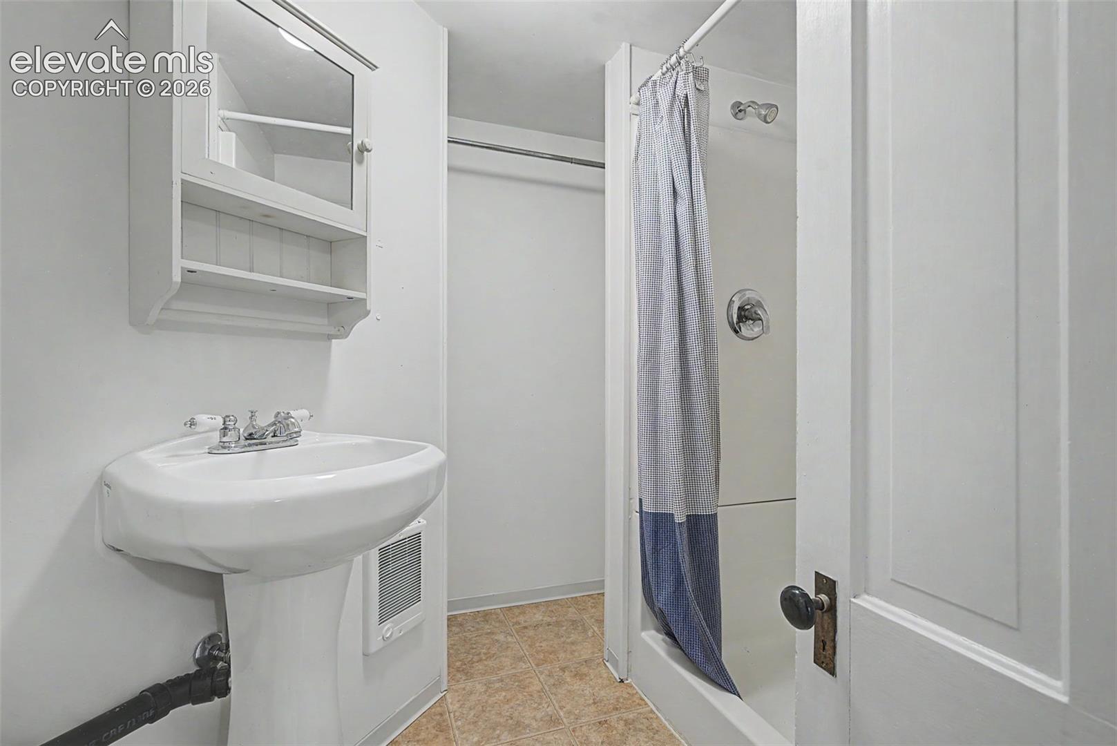 Secondary suite 3/4 bathroom with a closet