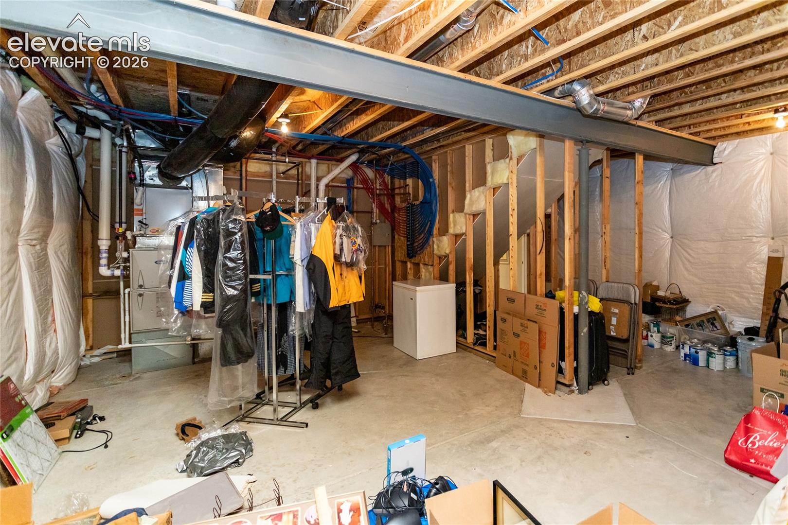 Unfinished basement area...plenty of room for all of your storage & holiday boxes.