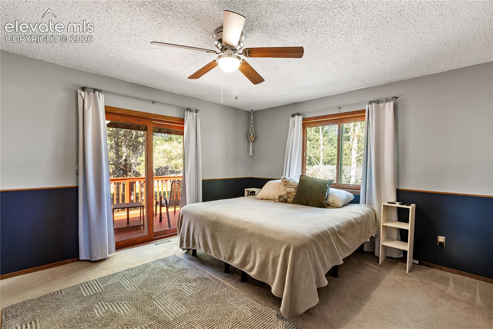 The primary bedroom is nice and big with its own private walk out to the back deck
