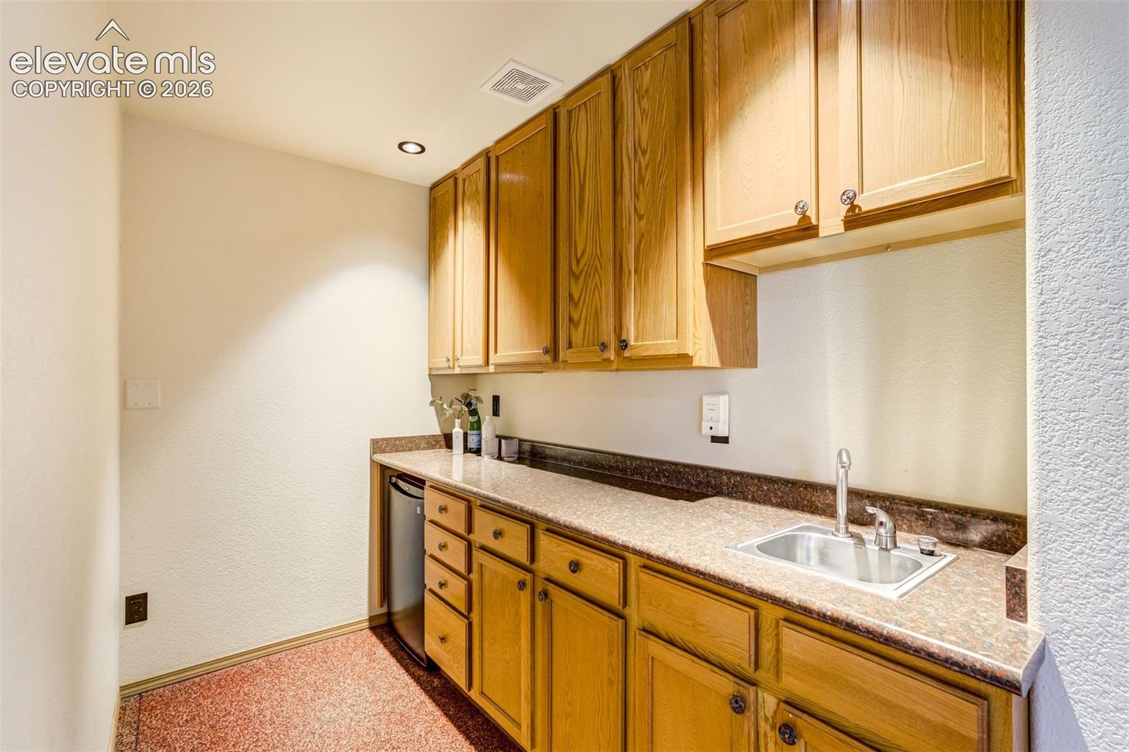 Wet bar in the basement. 