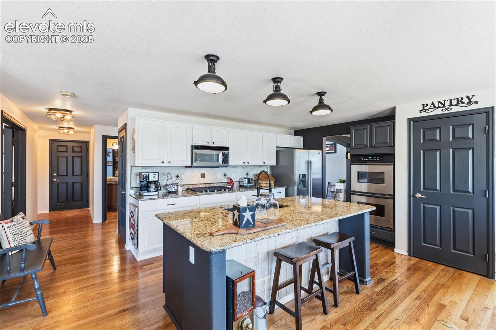 Spacious Updated Kitchen with Large Center Island & Abundant Cabinetry