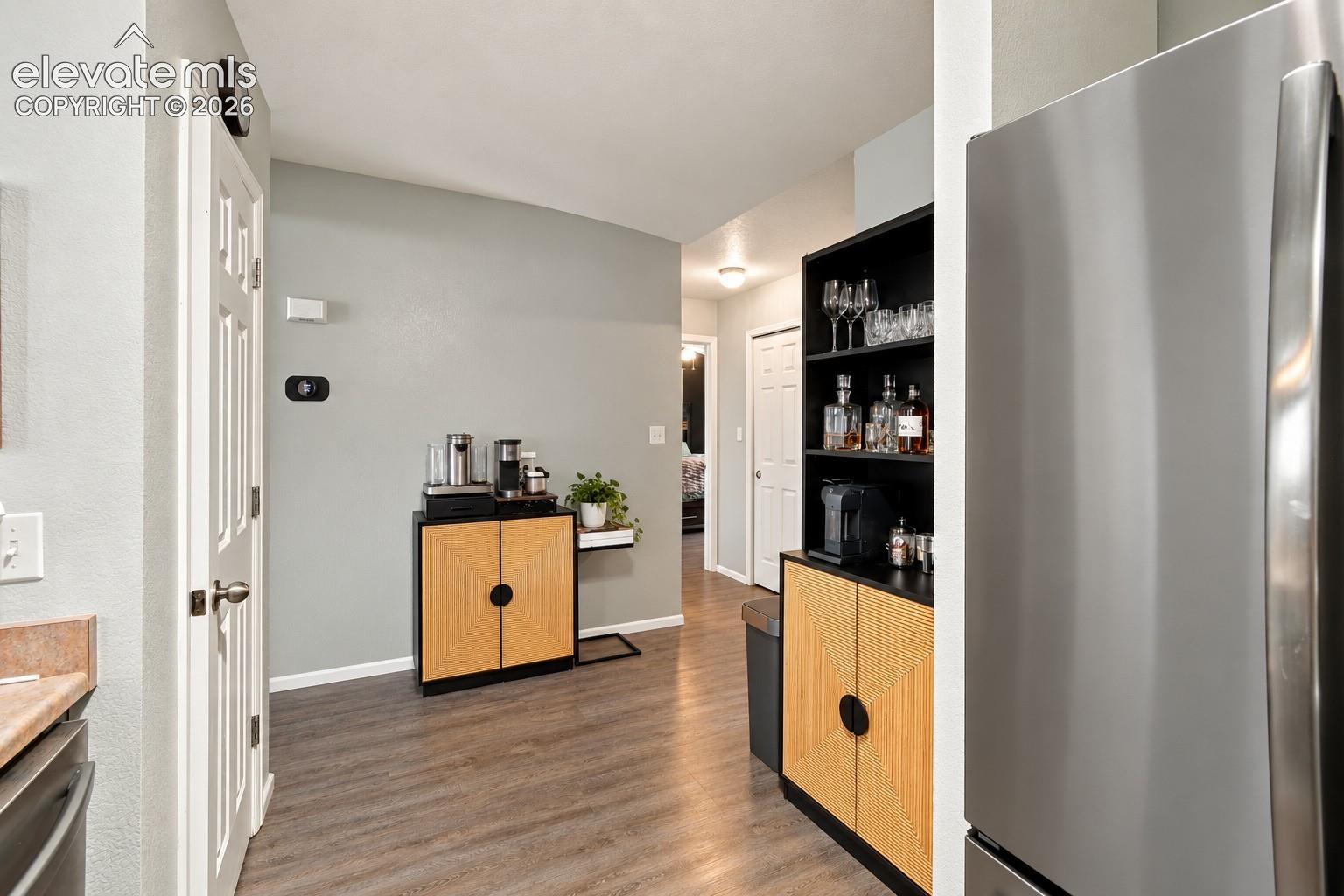 Stainless steel refrigerator and wood-finish flooring
