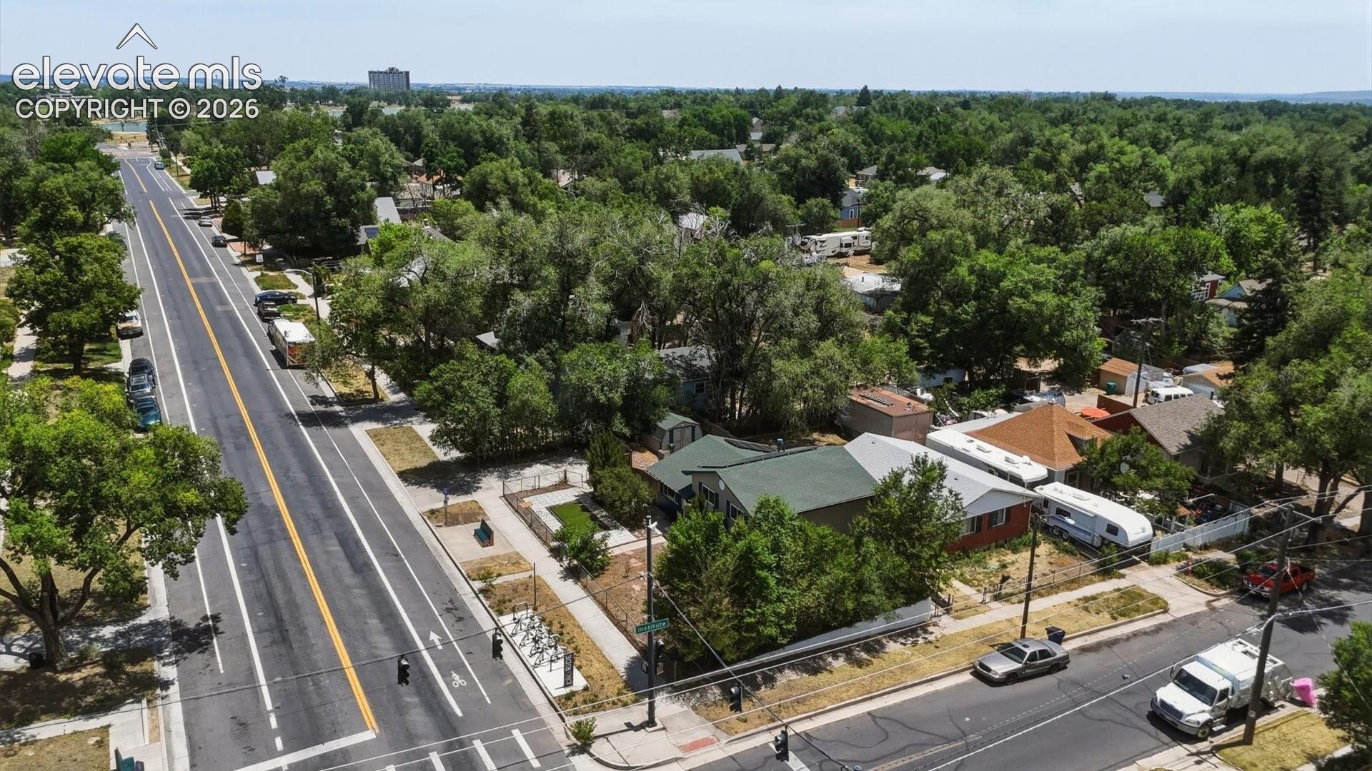 Aerial view of home and corner lot.