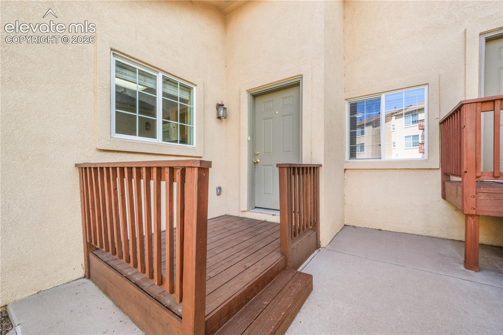 Front entry to home with patio