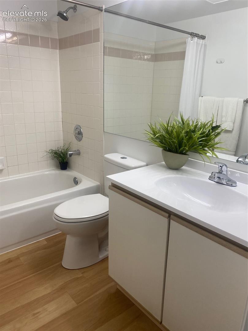 Upper level bathroom with tub and shower