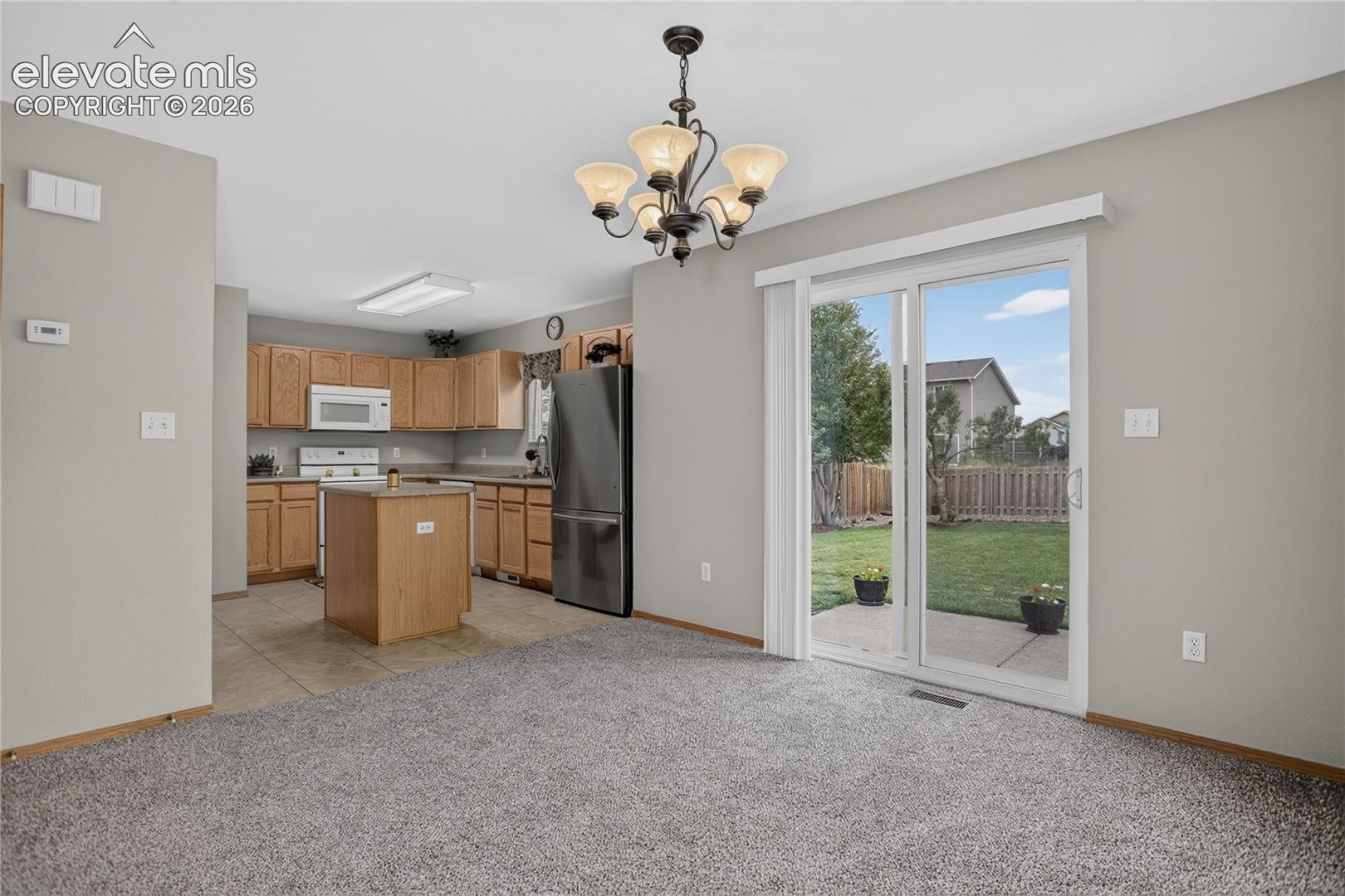 Kitchen with wood cabinetry and stainless steel appliances