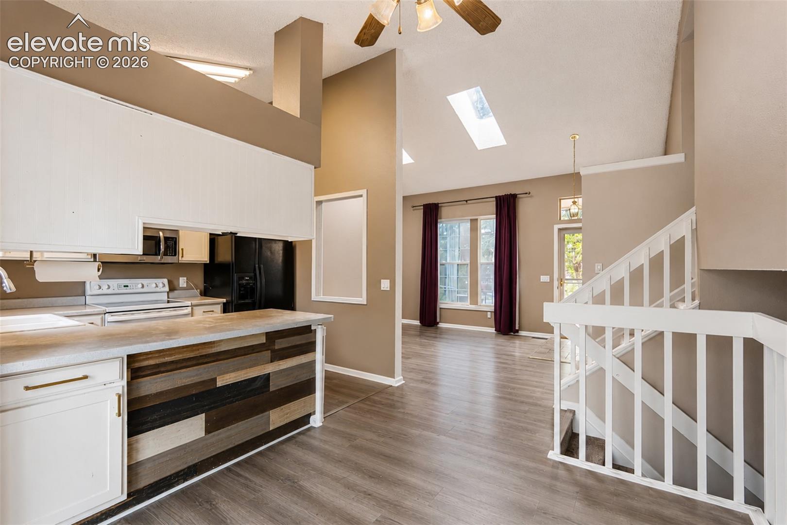 View of Dining Room, Kitchen, and Living Room.