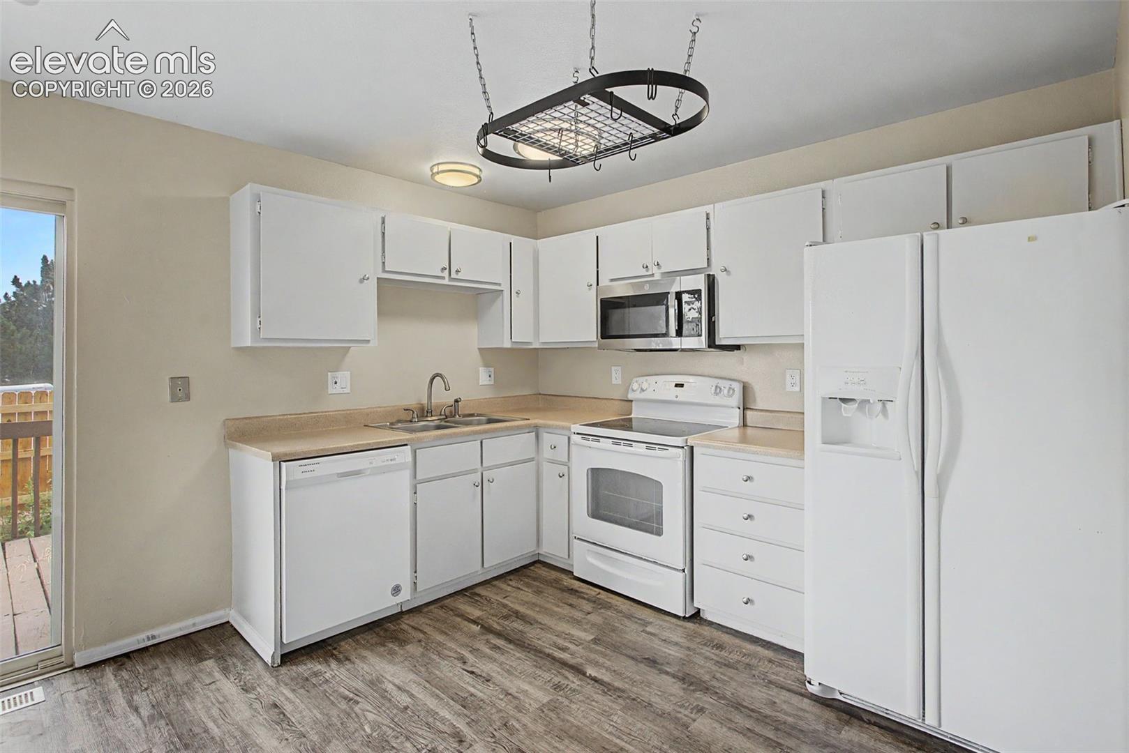The Kitchen is fully equipped with a Refrigerator, Range, Microwave and Dishwasher!