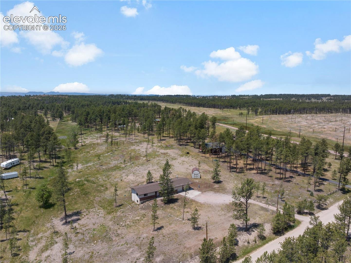 Aerial view of the house looking toward The Pineries Open Space trails