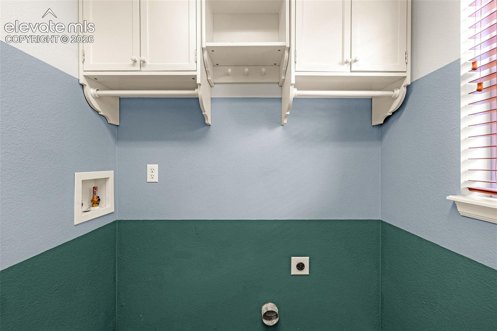 Overhead cabinets in the laundry room