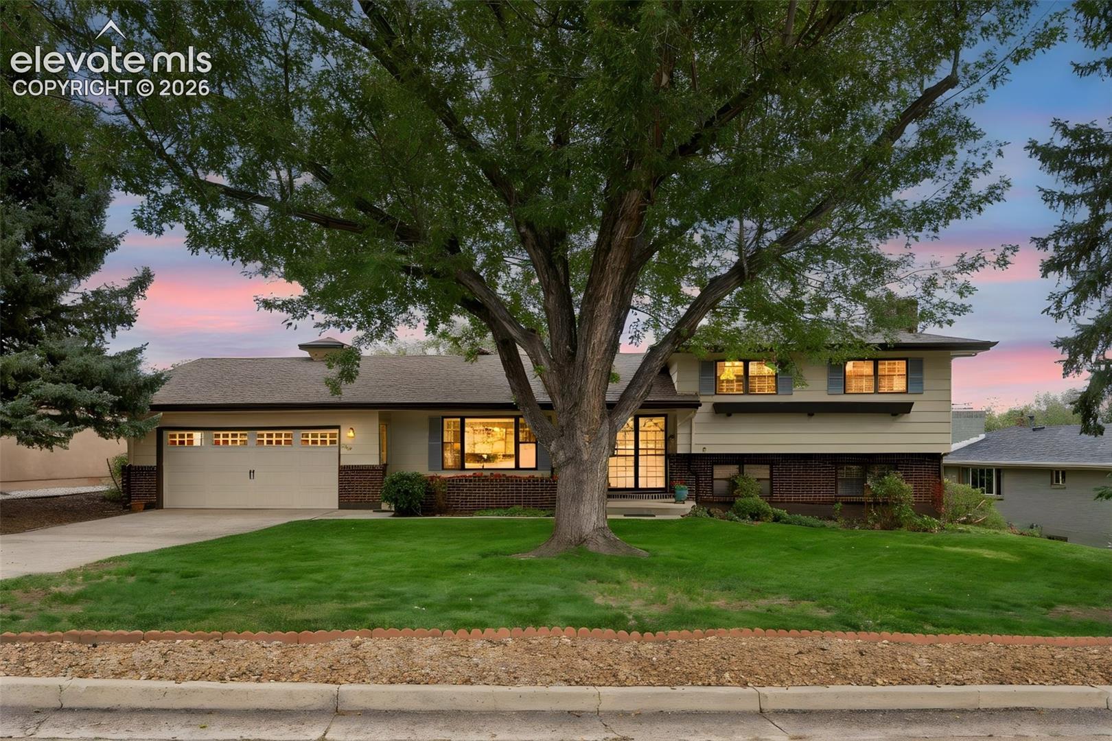 Beautiful Broadmoor area home with three bedrooms upstairs and a fourth on the lower level. 